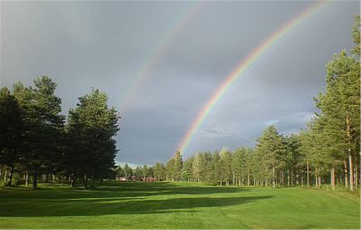 Rainbow over the golf-club.