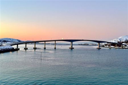 The bridge to Sommarøy with the sunset in the background