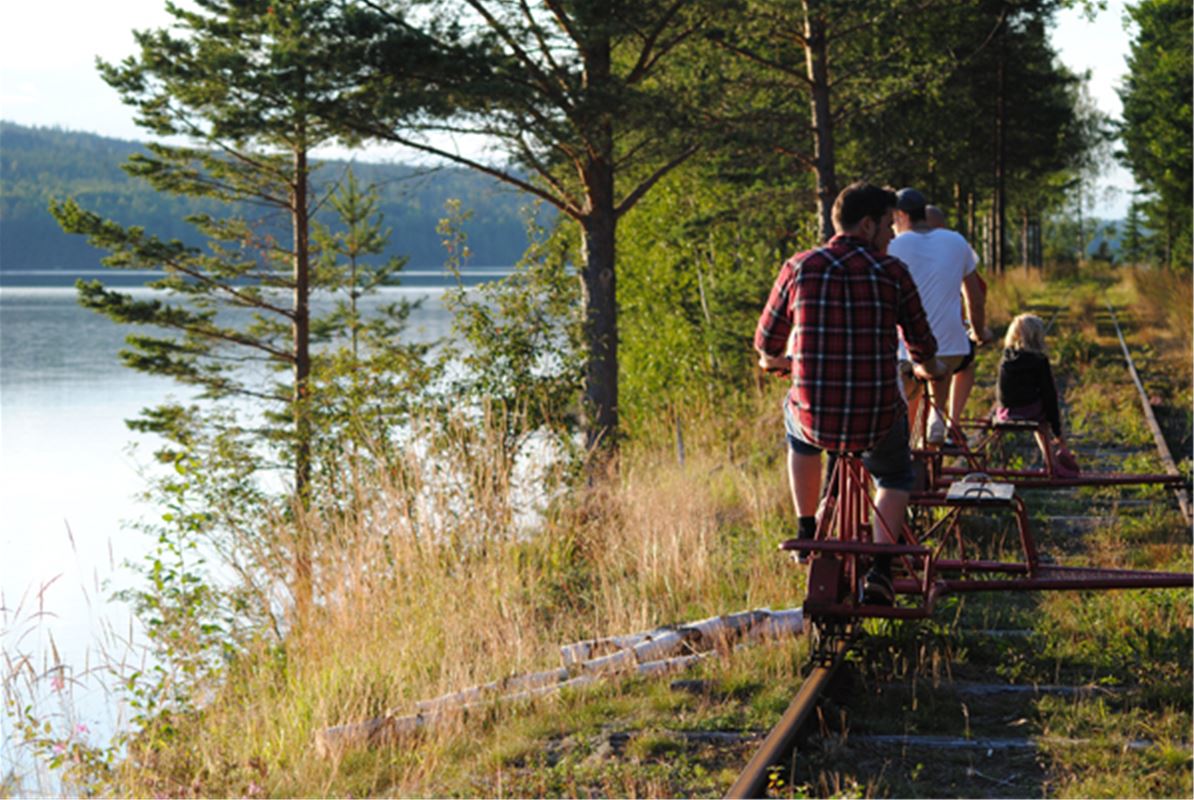 Railway trolley along a lake.