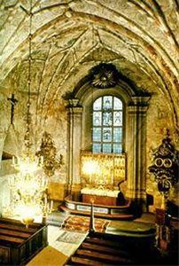 Interior image, frescoes and medieval wooden sculptures.