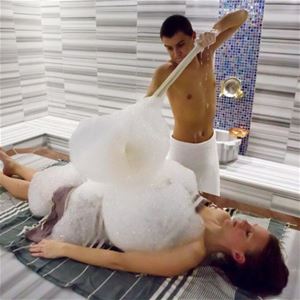 Woman getting foam on herself.
