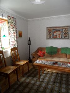 The livingroom with a sofa and two chairs.