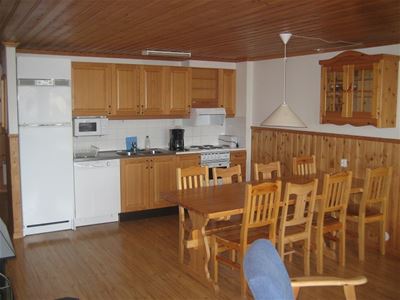 Kitchen area with dining table.