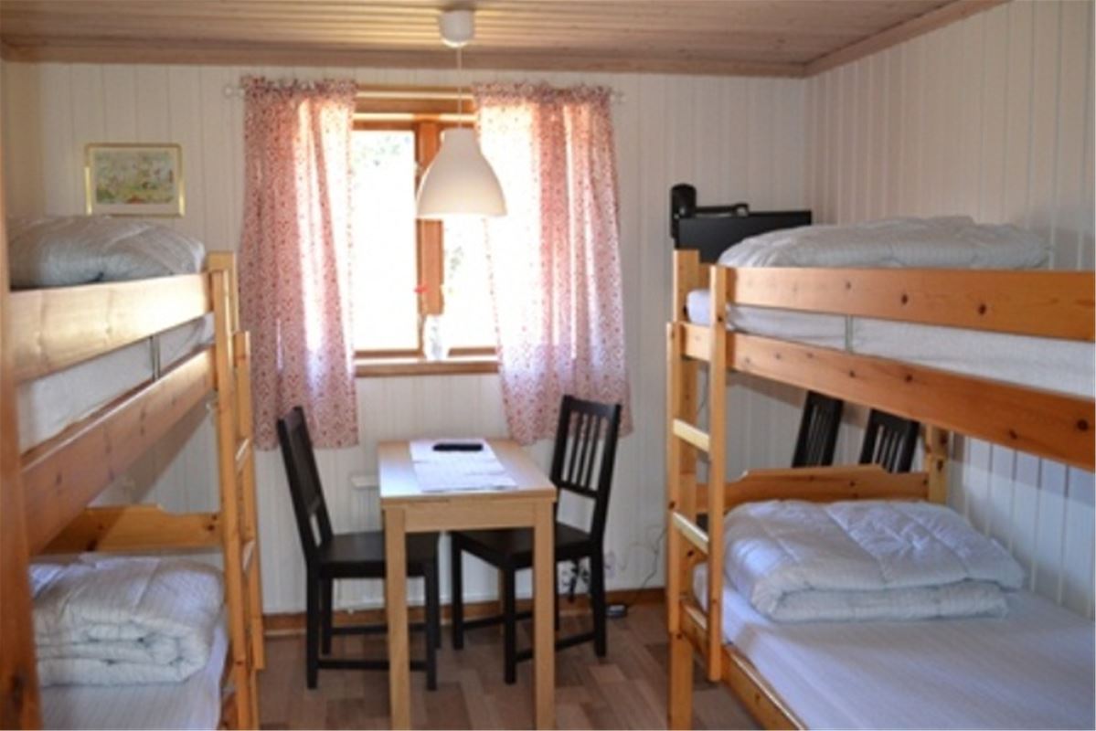 A room with two bunk beds.
