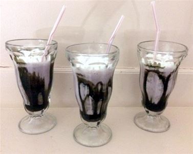 Three glasses of milkshake.
