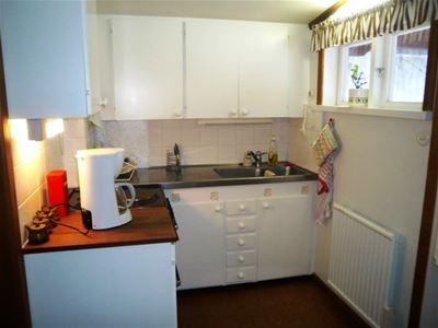 Pentry with white cabinet doors. 