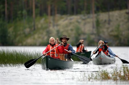 Three people canoeing