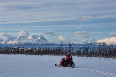 Guests on snowmobile