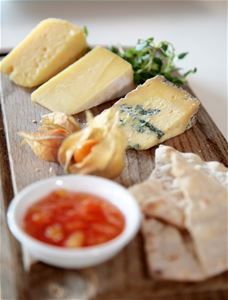 Different cheeses on tray.