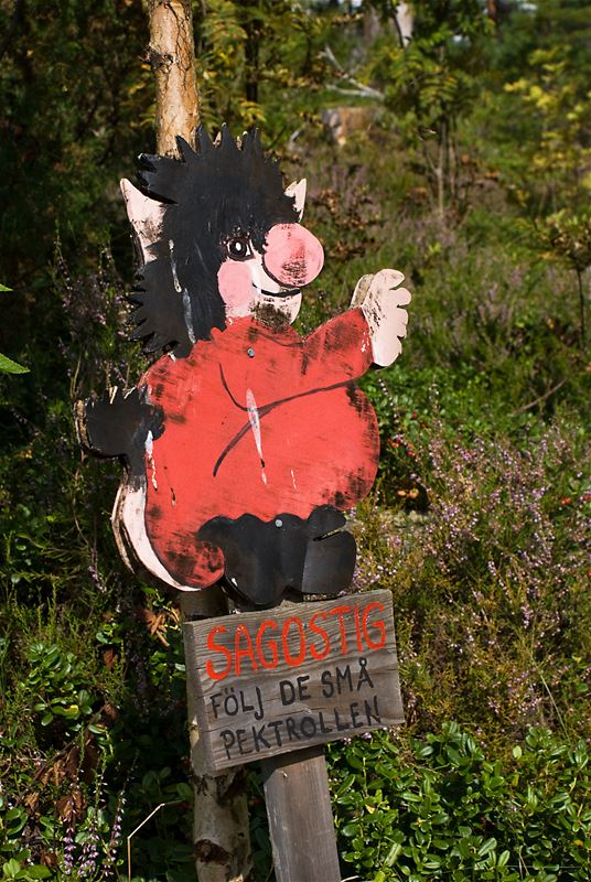 Sign with text and a troll.
