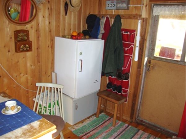 Fridge close to the hall in the cabin. 