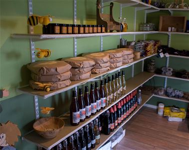 Shelves with bread and drinks.