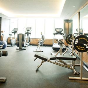 The gym with various exercise equipment.