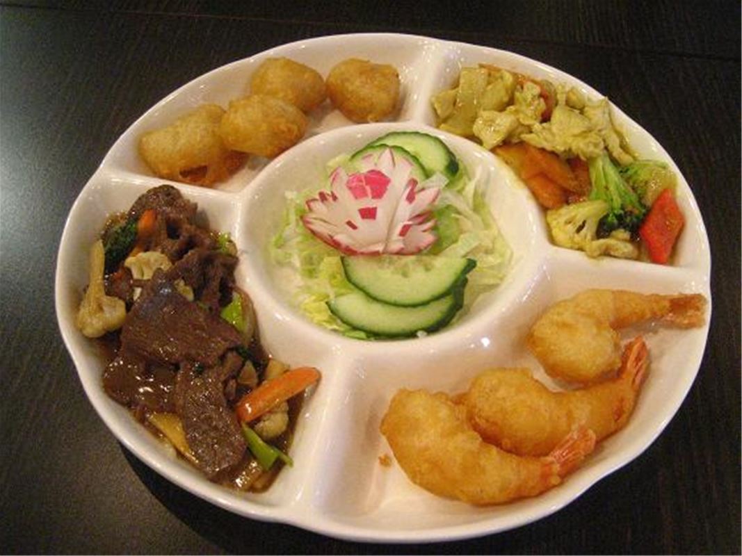 Serving plate with various small dishes.