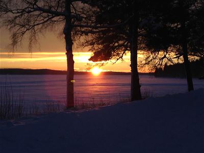  Sunset by the frozen lake.