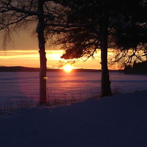  Sunset by the frozen lake.