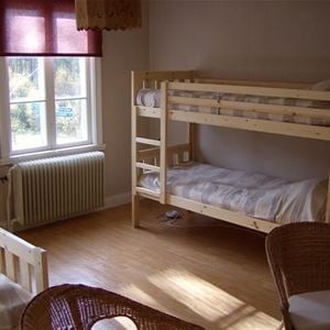 Room with a double bed and bunk beds.