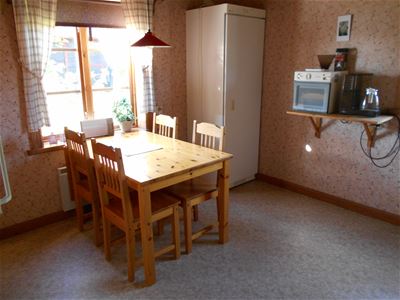 A dining table in the kitchen.