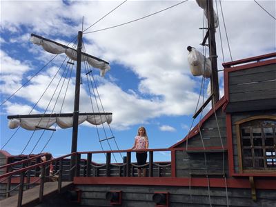 A child on a pirate ship.