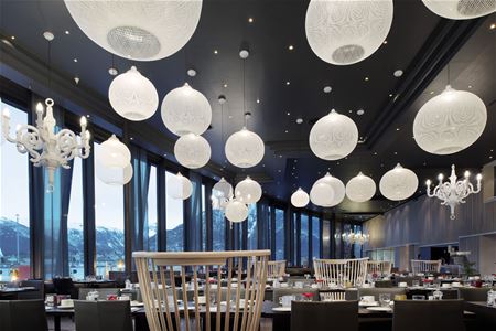 Restaurant with many lamps.