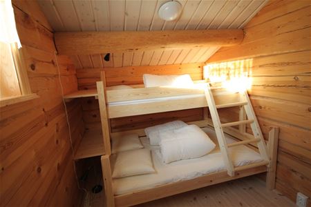 A bedroom with a bunk bed.