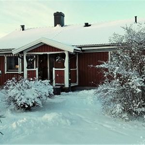The red single storey villa on a winter day.