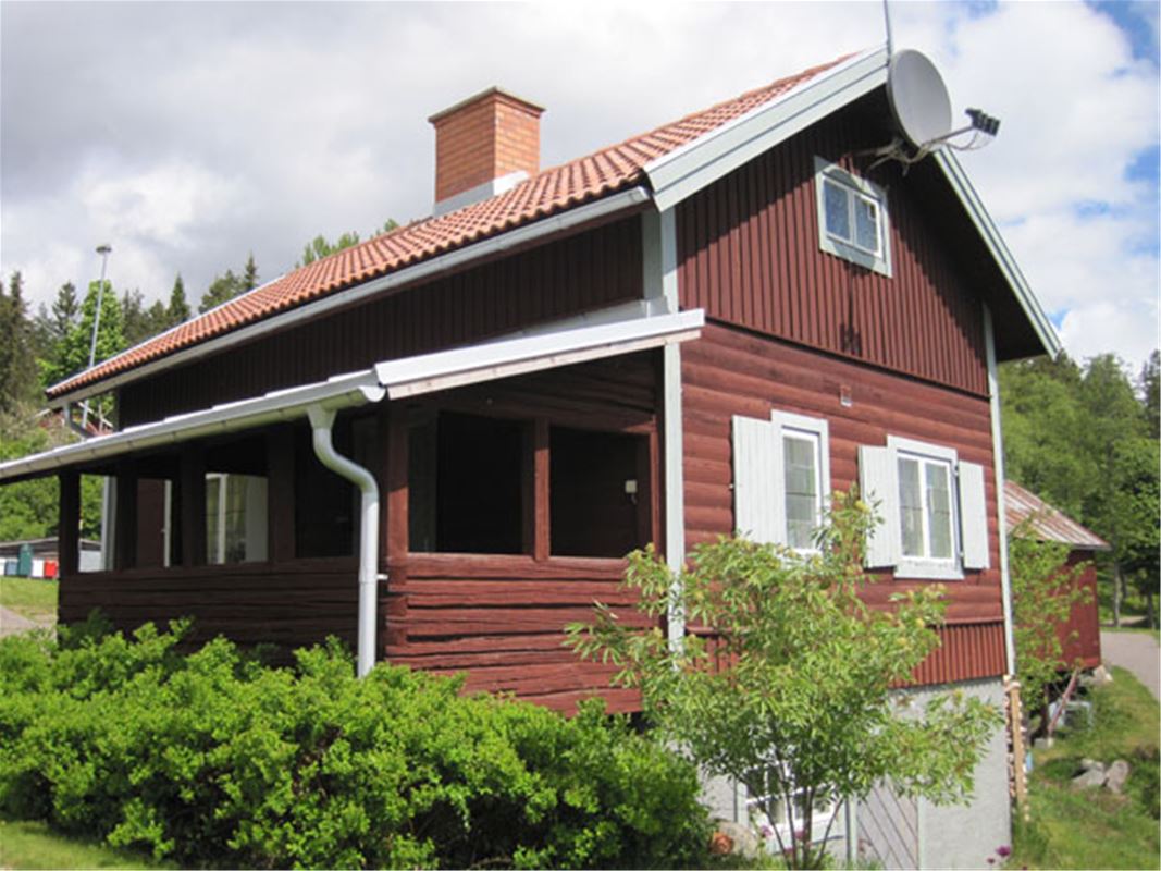 Cottage in Bjursås with repainted exterior and a veranda.