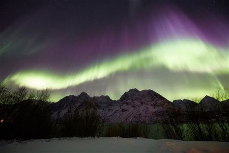 Northern lights over  mountains