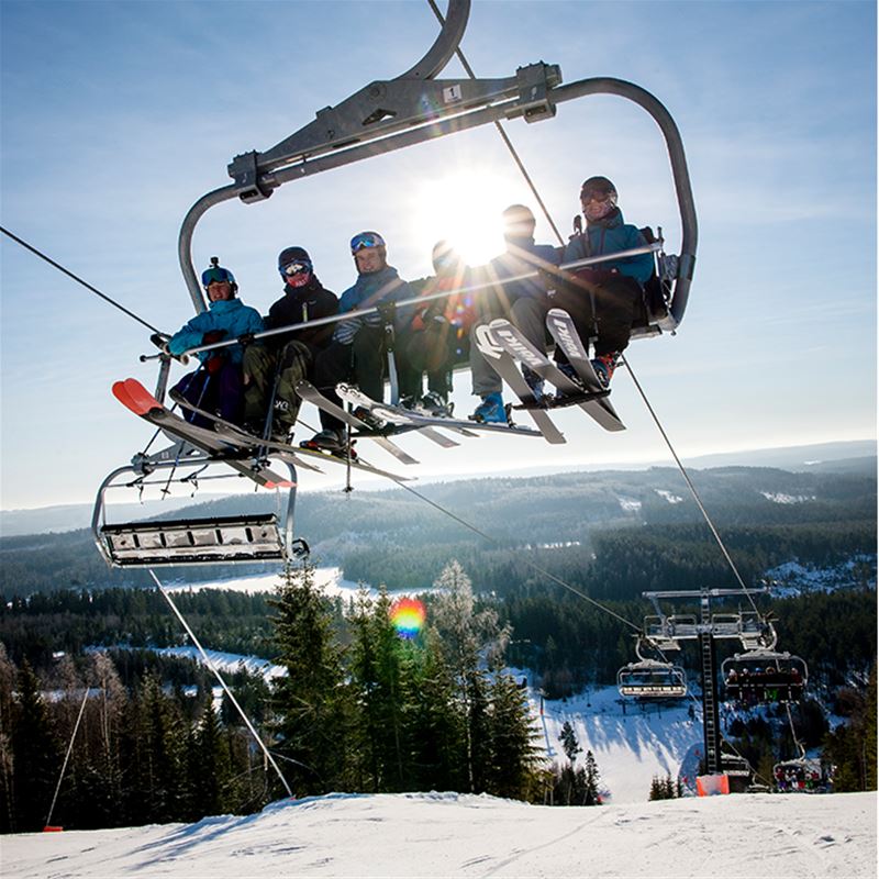 people in ski lift.