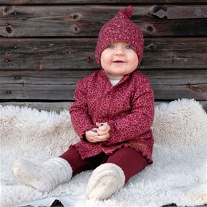 A baby with wool clothes.