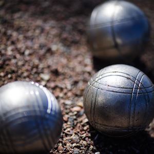 Boule balls in the sand.