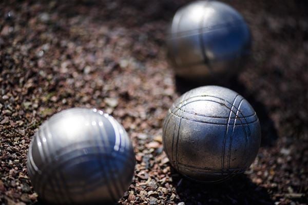 Boule balls in the sand. 
