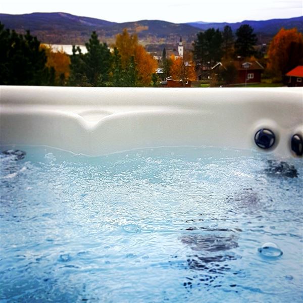 Detail from a jacuzzi with a view over lake Siljan during autumn.  