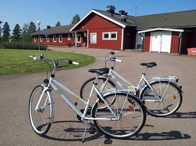Two bicycles in front of the hostel. 
