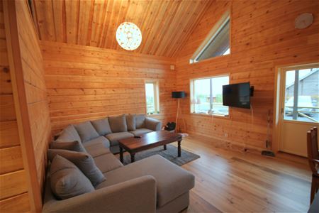 Room with a sofa and tv.