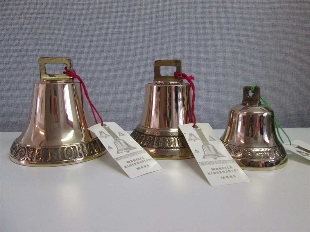 Three brass bells.
