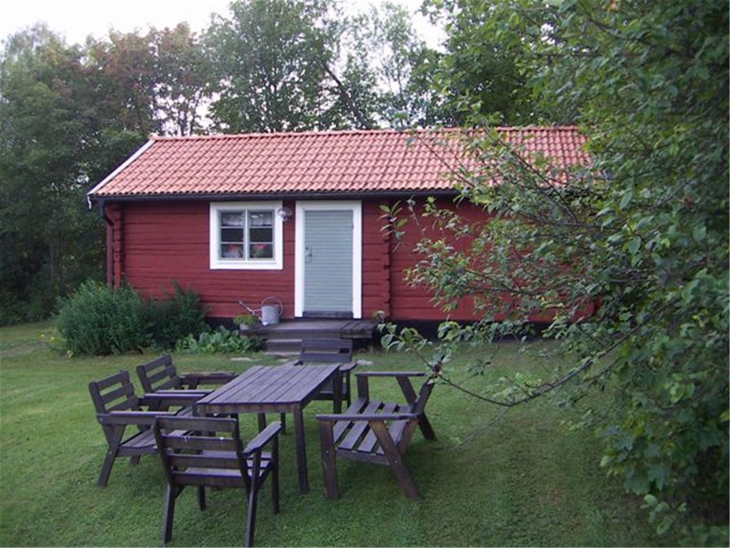 Exterior of red cottage, Engelbrekt n summer.