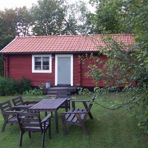 Exterior of red cottage, Engelbrekt n summer.