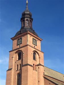 The churchtower, the church is in red brick.