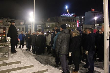 A group of people gathered around their guide