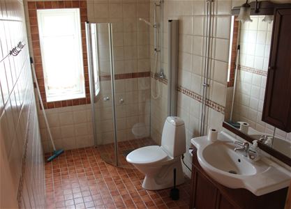 Bathroom with shower and toilet.