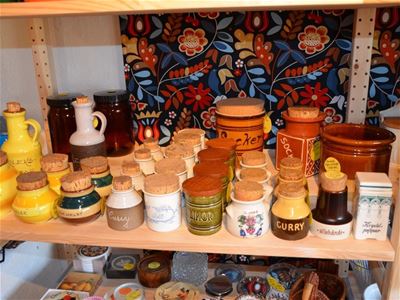  A shelf with old jars on it