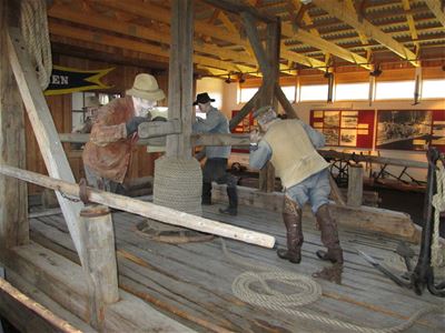 Dolls showing work in sawmills.