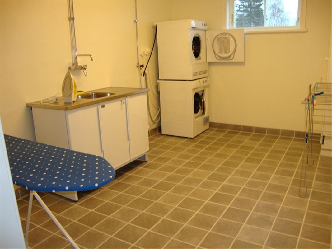 Laundry with washing machine, dryer  and a sink.