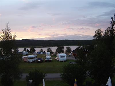 A lot of trailers parked on the campsite.