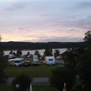 A lot of trailers parked on the campsite.