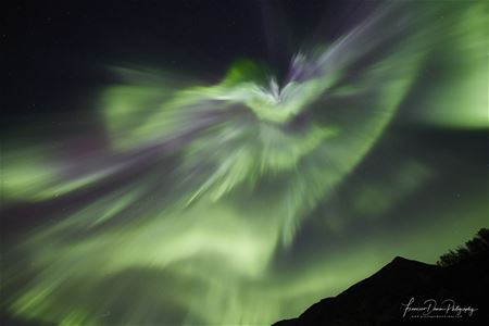strong northern lights dancing in the sky