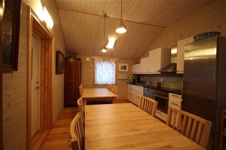 Kitchen with diniing places in wooden furniture. 