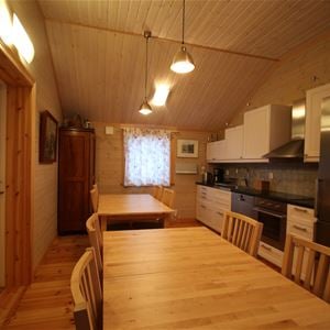 Kitchen with diniing places in wooden furniture. 