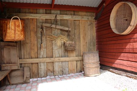 Red timber wall and an old door. 